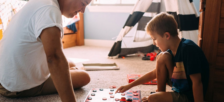 Dad and son playing checkers
